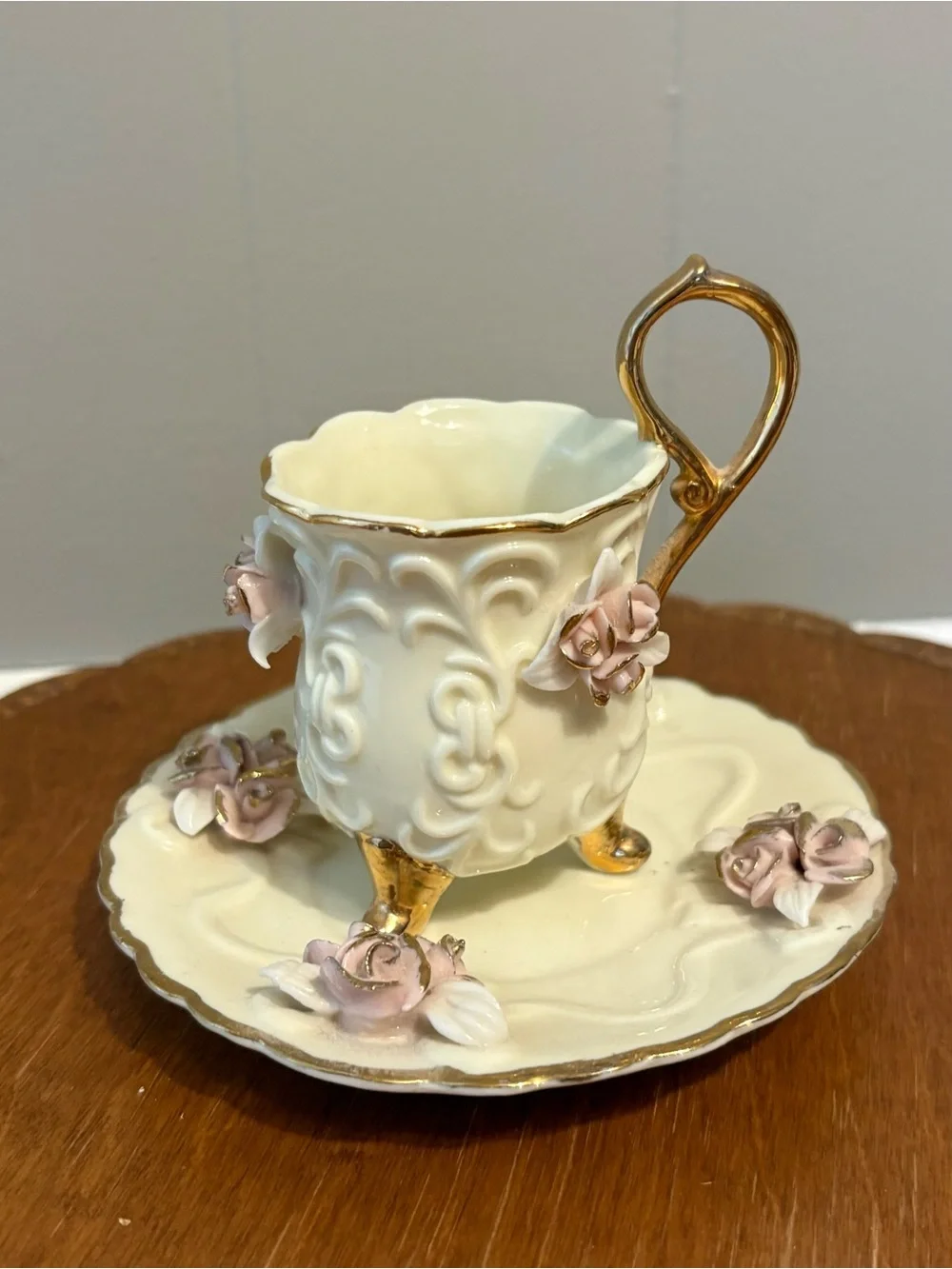 Ornate White Porcelain Pedestal Cup & Saucer with Pink Roses and Gold Trim
